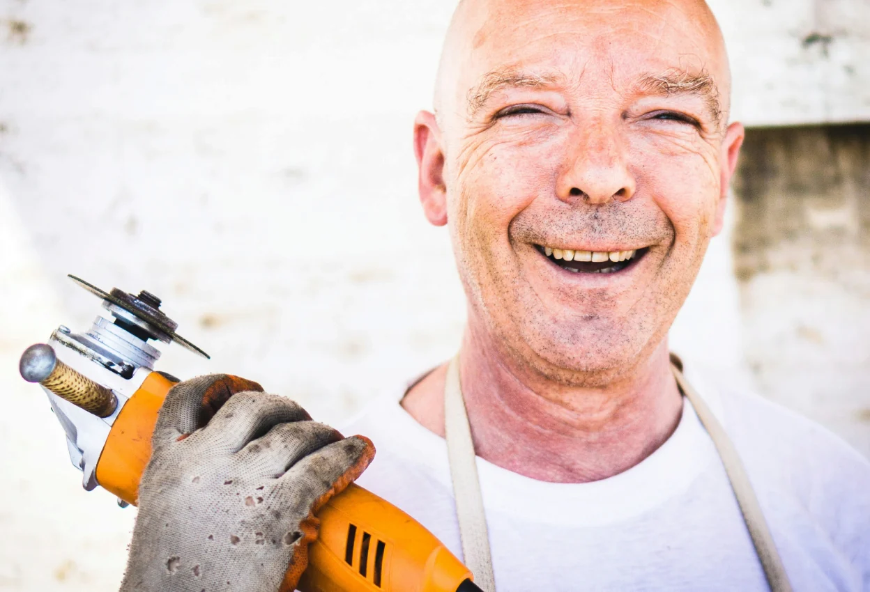 An independent pro with a grinder, ready for a job